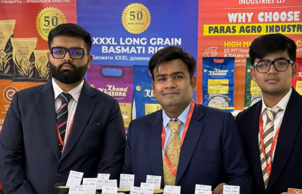 Team showcasing basmati rice samples at an exhibition